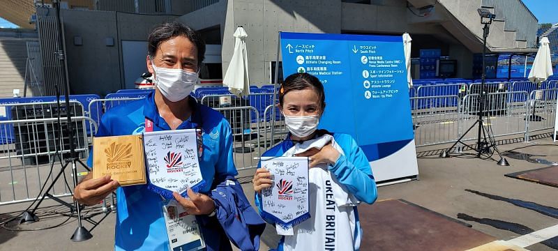 Teruki Nakazawa and Ikumi Mukiada Enter caption Ikumi with Pennant and Tshirt caption