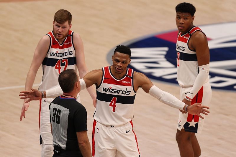 Russell Westbrook (#4) of the Washington Wizards talks with referee Brent Barnaky (#36)