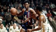 Oscar <a href='https://www.sportskeeda.com/basketball/oscar-robertson' target='_blank' rel='noopener noreferrer'>Robertson</a> handles the ball.