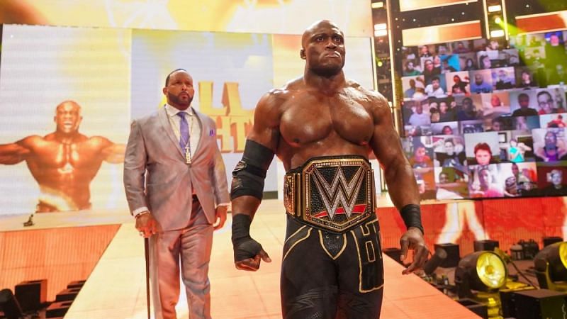 Bobby Lashley flanked by his manager MVP