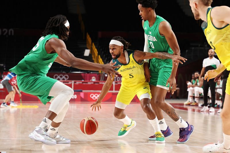 Patty Mills #5 of Team Australia looks to pass as he&#039;s surrounded by Team Nigeria