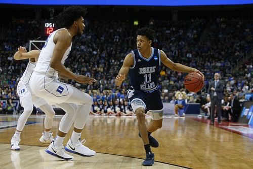 Jeff Dowtin #11 dribbles against Marvin Bagley III.