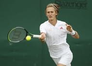 Sebastian Korda hits a forehand at Wimbledon 2021