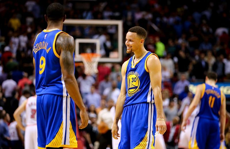 Stephen Curry (right) and Andre Iguodala with the Golden State Warriors