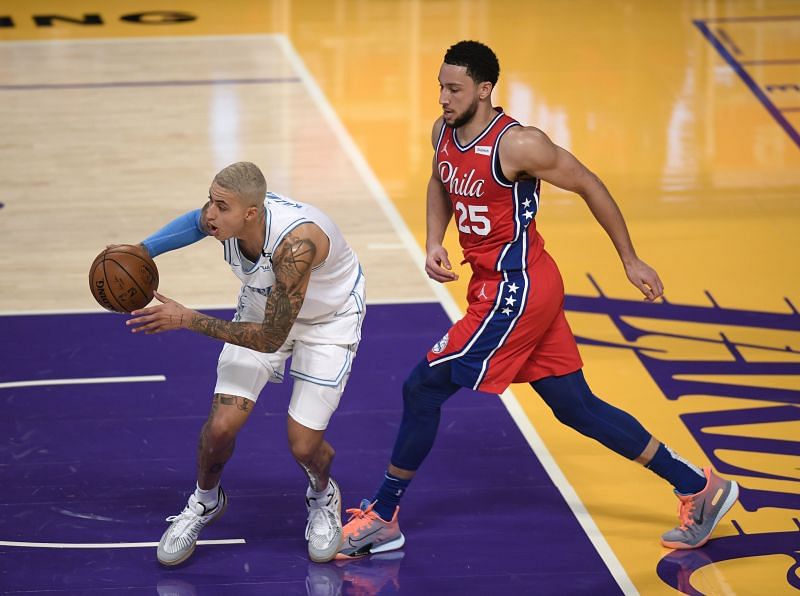Ben Simmons and Kyle Kuzma compete for a possession.