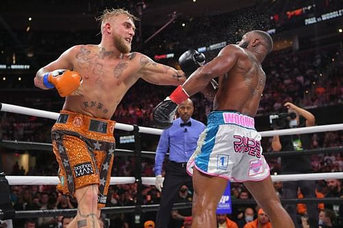 Jake Paul (left) defeated Tyron Woodley (right) via split-decision