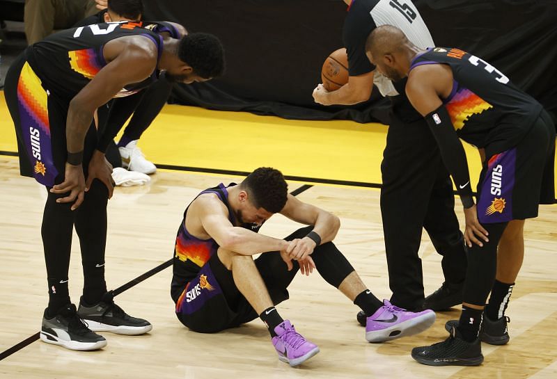 Chris Paul consoles backcourt partner Devin Booker in the NBA Finals