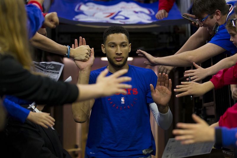 Ben Simmons #25 of the Philadelphia 76ers high fives fans as he enters the court ahead of a game
