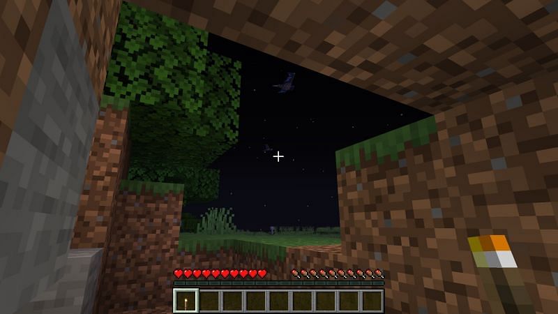 Player hiding in the shelter (Image via Minecraft)