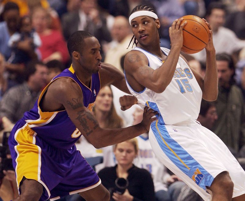 Carmelo Anthony (right) goes up against Kobe Bryant (Photo Credit: David Zalubowski/AP/Shutterstock.)