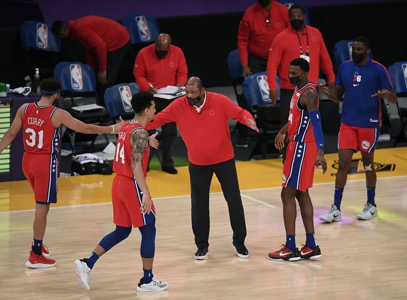 Doc Rivers of the Philadelphia 76ers celebrates with Seth Curry #31, Danny Green #14 and Paul Reed #44