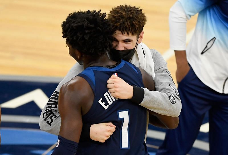 Anthony Edwards #1 of the Minnesota Timberwolves hugs LaMelo Ball #2 of the Charlotte Hornets.