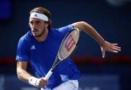Stefanos Tsitsipas chases a ball in Toronto