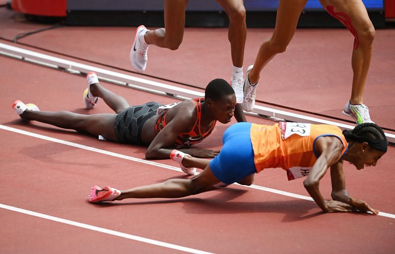 Sifan Hassan of Team Netherlands and Edinah Jebitok of Team Kenya trip and fall during round one of the Women&#039;s 1500m heats on day ten of the Tokyo 2020 Olympic Games