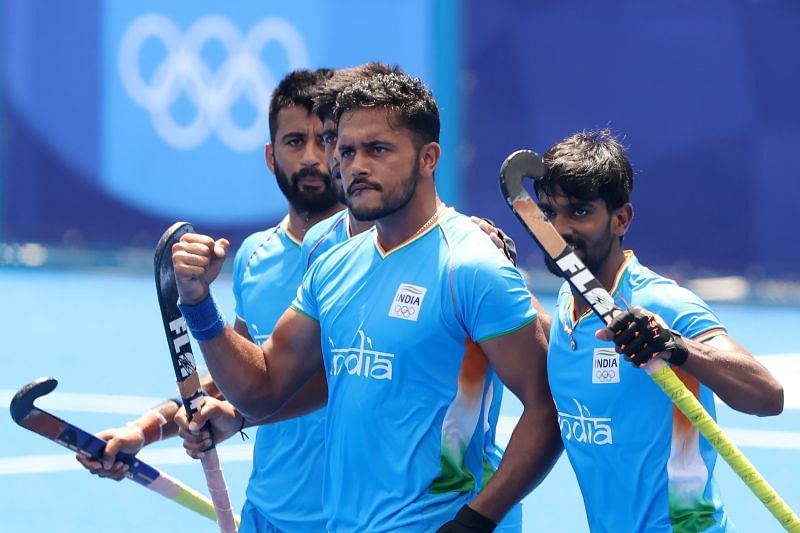 Harmanpreet Singh (C) celebrates scoring the first goal with Sumit and teammates during the Men&#039;s Semifinal match between India and Belgium