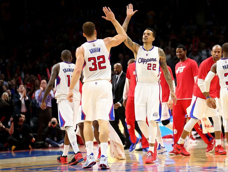 Matt Barnes (#22) and Blake Griffin (#32) of the LA Clippers celebrate during the fourth quarter against the Denver Nuggets at the Staples Center