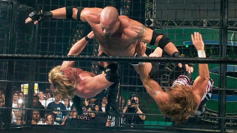 Goldberg taking down Chris Jericho and Shawn Michaels inside the Elimination Chamber