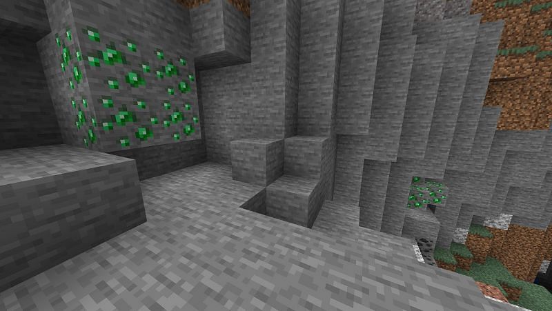 Exposed emerald ores seen in bedrock beta (Image via Minecraft)
