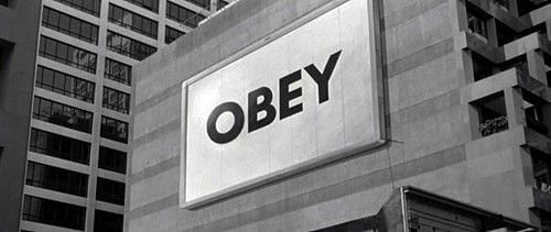 They Live billboard. Image via MoPOP