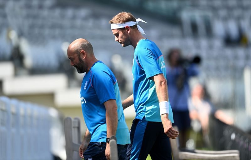 Stuart Broad walks off the ground with an injury