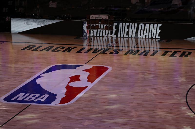 The NBA logo displayed on a basketball court.