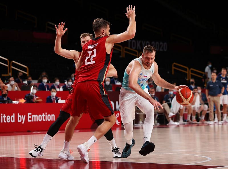 Zoran Dragic #30 drives to the basket against Danilo Barthel #22.