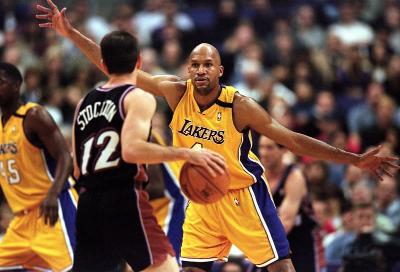 Ron Harper (#4) of the LA Lakers guards John Stockton (#12) of the Utah Jazz at the Staples Center in Los Angeles, California.