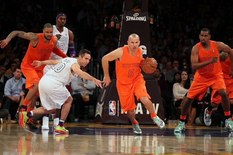 Jason Kidd #5 dribbles past Steve Nash #10 during a New York Knicks v Los Angeles Lakers game