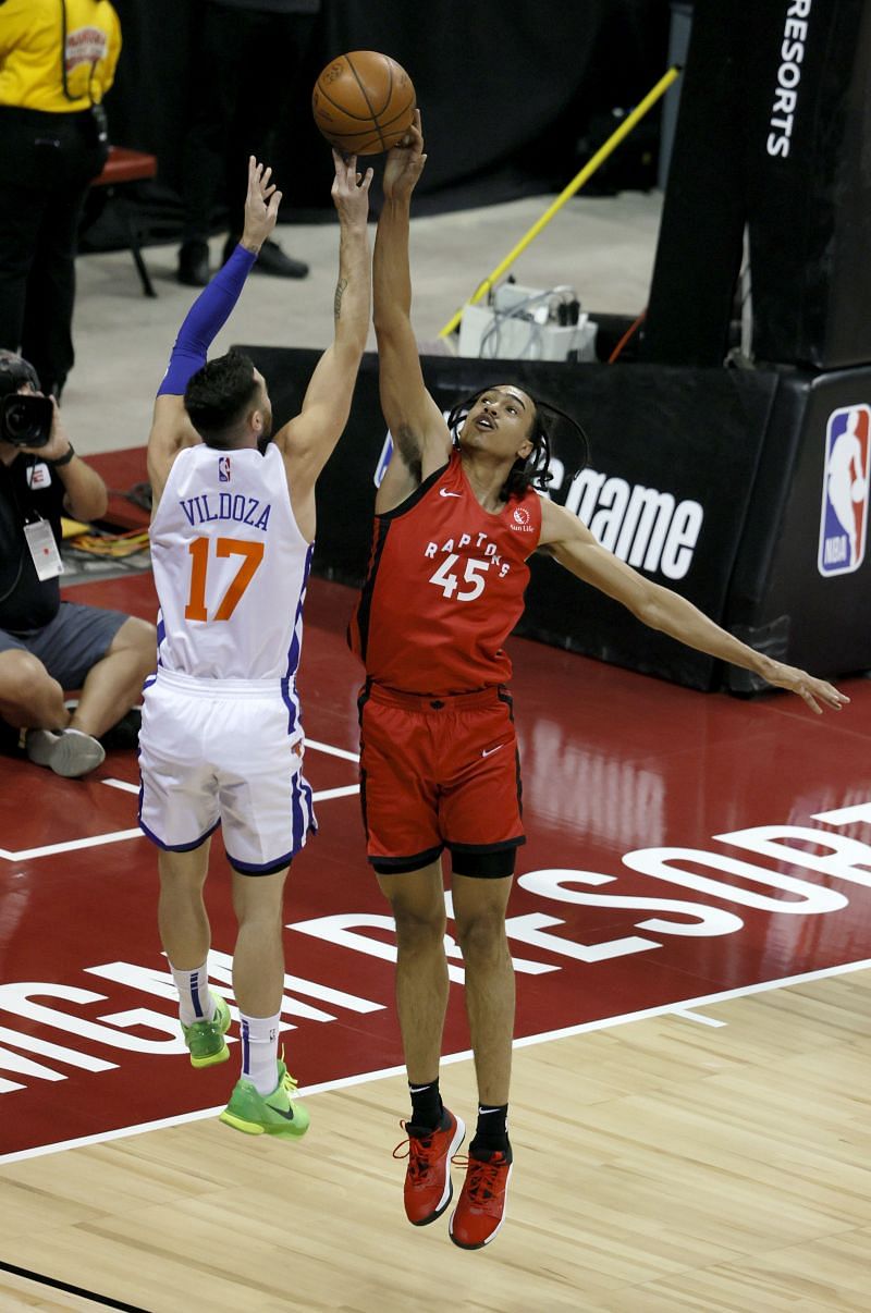 Dalano Banton #45 of the Toronto Raptors blocks a shot by Luca Vildoza #17