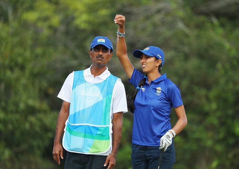 Aditi Ashok chats with her father/caddie Pandit Gudlamani Ashok during the second round of the Women&#039;s Individual Stroke Play golf at the Rio 2016 Olympic Games
