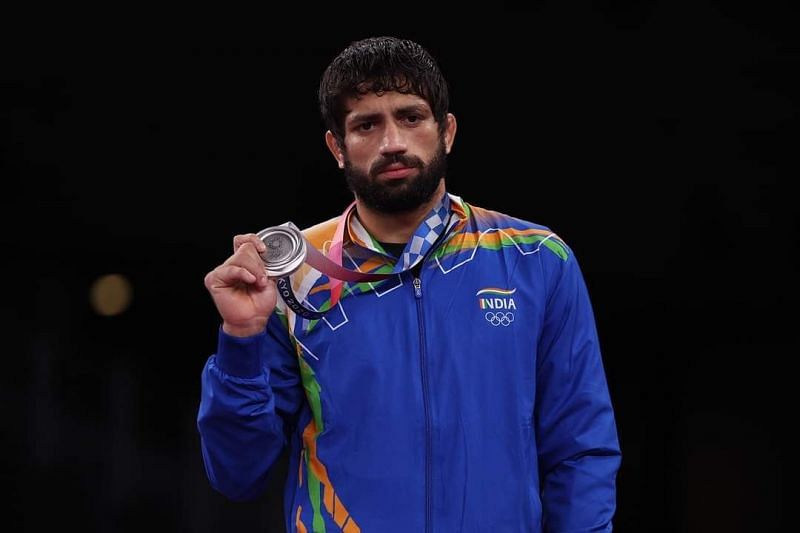 Ravi Dahiya posing with his silver medal from the Tokyo Olympics
