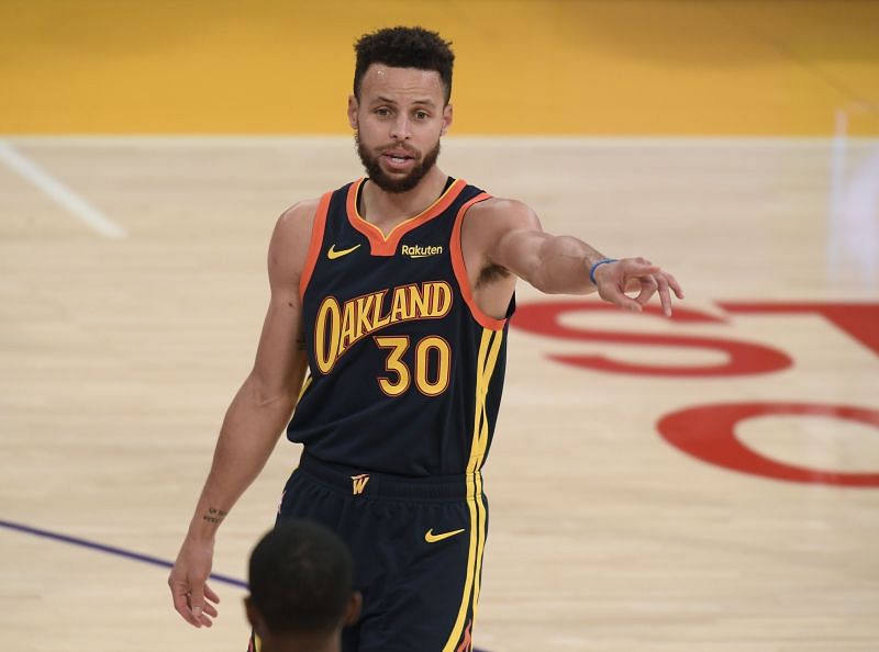 Stephen Curry #30 of the Golden State Warriors directs a play