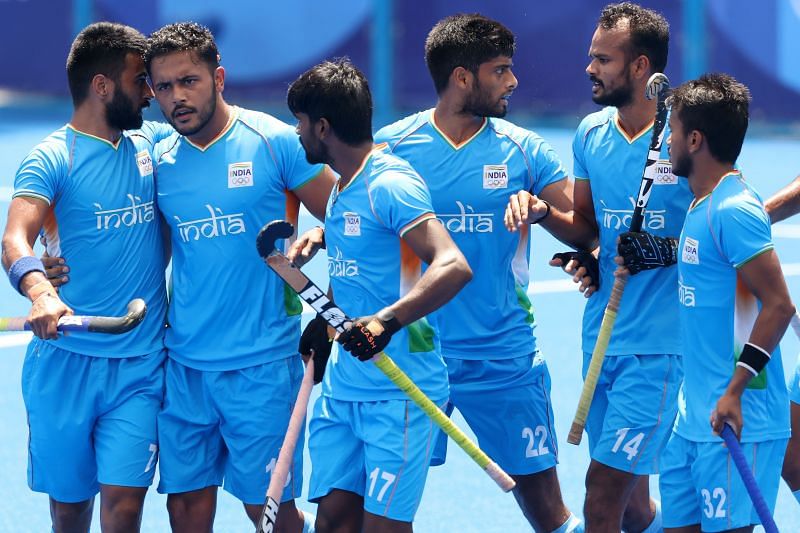 Harmanpreet Singh celebrates scoring the first goal with teammates during the men&#039;s semifinal match between India and Belgium