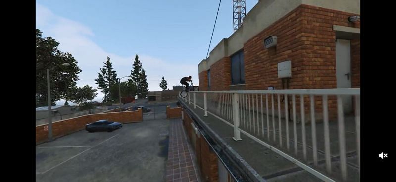 Sliding over the rails with the BMX (Image via Rockstar Games)