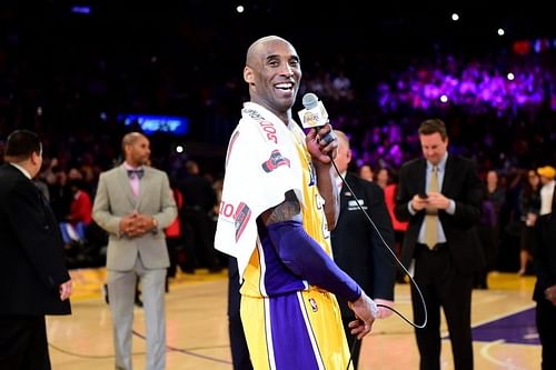 Kobe Bryant #24 addresses the crowd after scoring 60 points in his final NBA game.