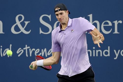 John Isner hits a forehand at the 2021 Cincinnati Masters