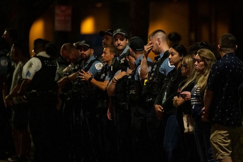 Chicago Police Officers await procession on August 8 (Image via Chicago Sun-Times)