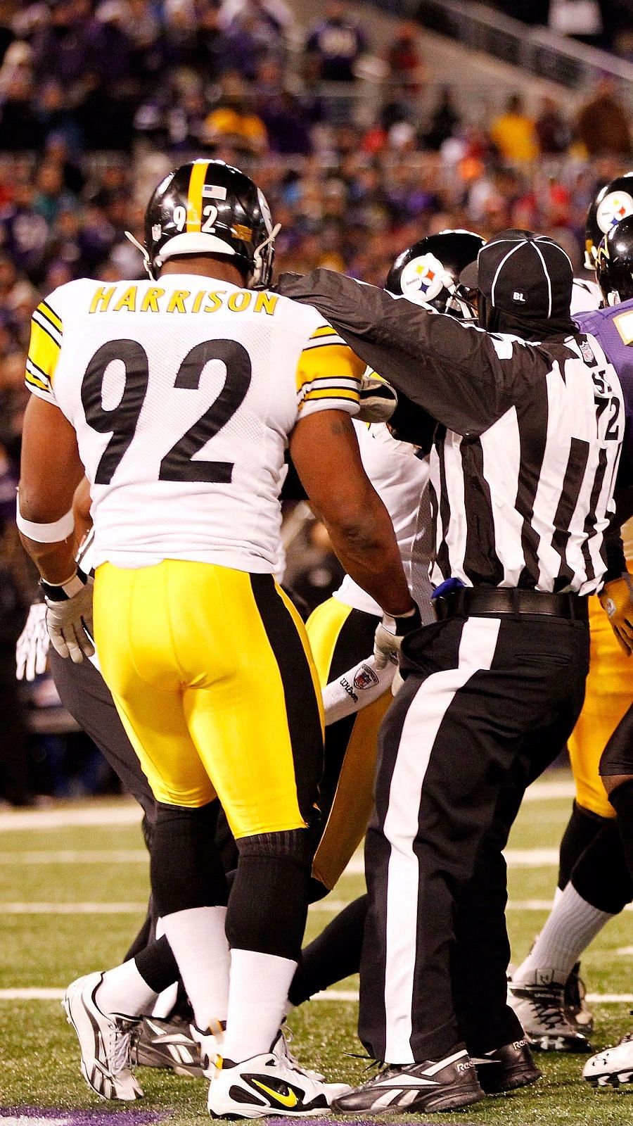 Pittsburgh Steelers linebacker James Harrison (92) is greeted by teammates  as he takes the field prior