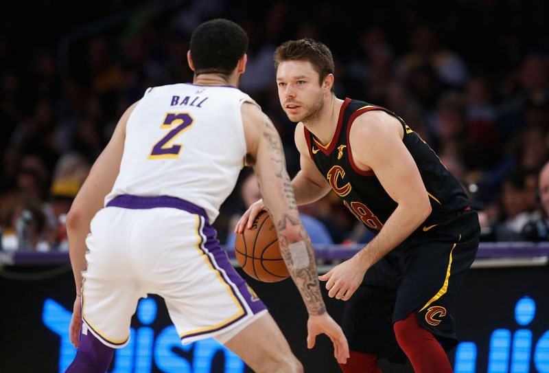 Matthew Dellavedova (#18) of the Cleveland Cavaliers looks to dribble past Lonzo Ball (#2).