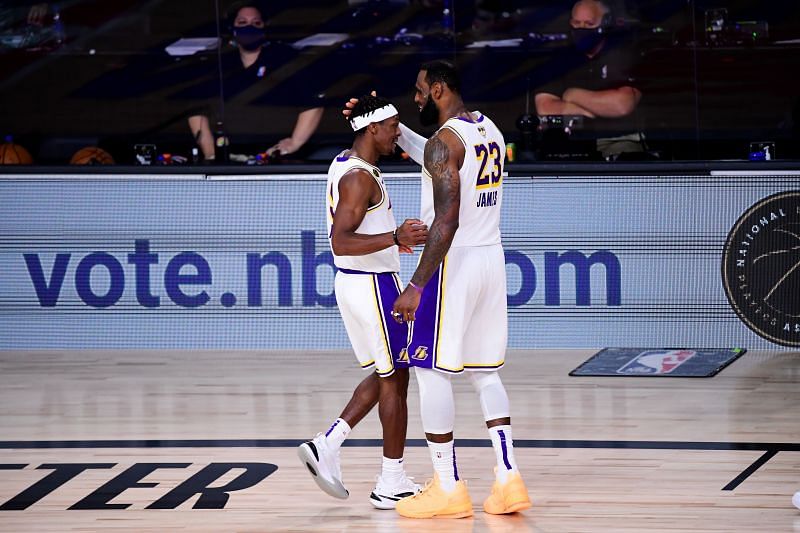 LeBron James #23 of the Los Angeles Lakers reacts with Rajon Rondo #9