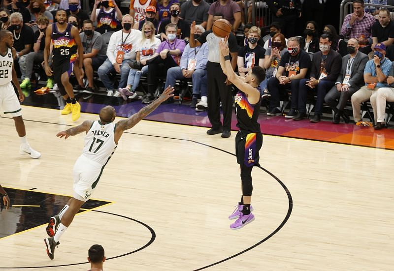 Devin Booker (#1) of the Phoenix Suns shoots.