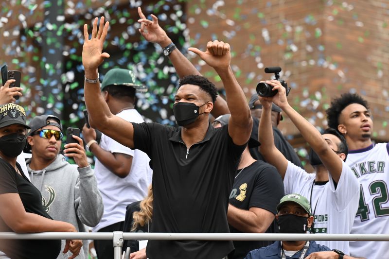 Giannis Antetokounmpo of the Milwaukee Bucks cheers with the crowd during the Milwaukee Bucks&#039; 2021 NBA Championship parade.