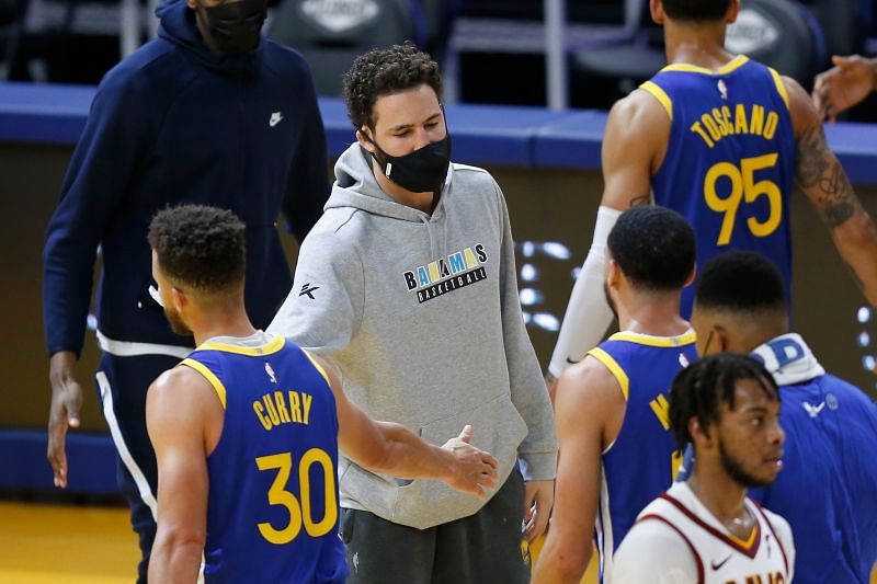 Klay Thompson #11 of the Golden State Warriors greets teammates.