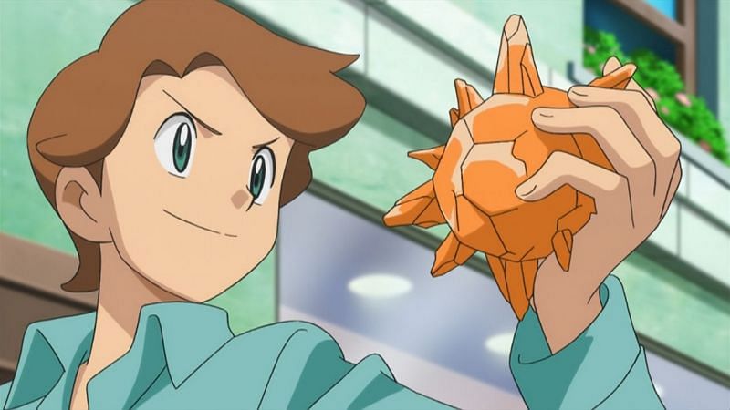 A Trainer holding a Sun Stone in the Anime (Image via The Pokemon Company)