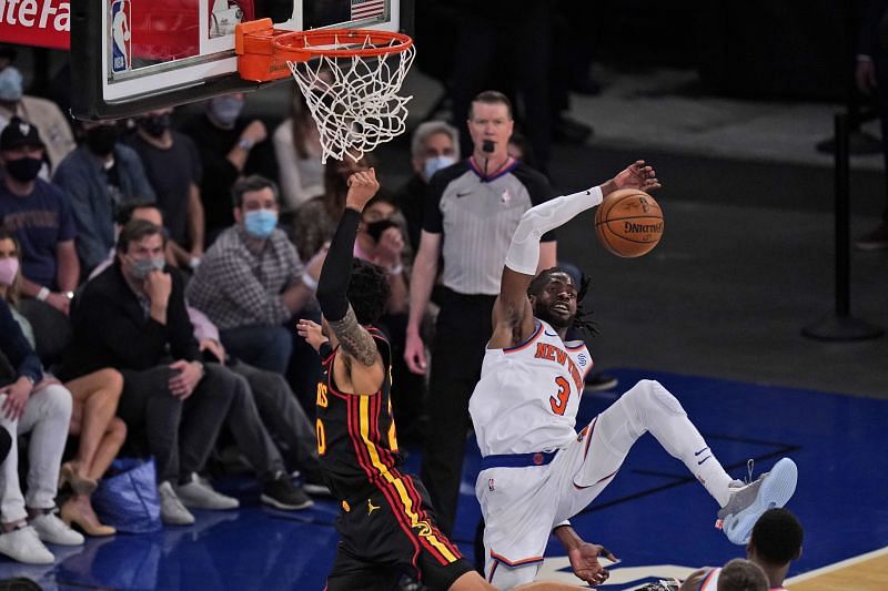 New York Knicks&#039; Nerlens Noel, right, blocks a shot put up by Atlanta Hawks&#039; John Collins,