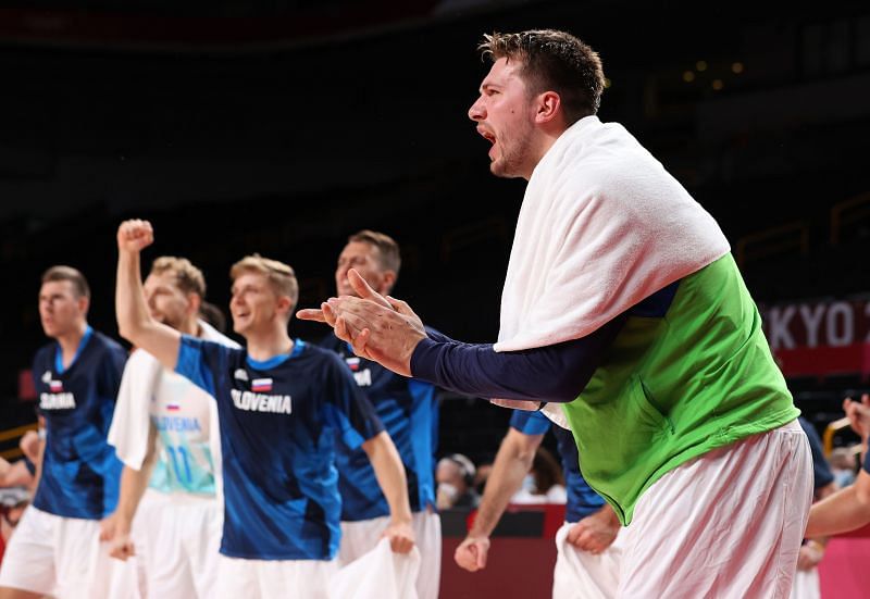 Luka Doncic #77 celebrates from the bench against Team Germany