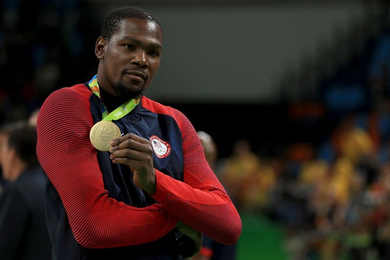 Kevin Durant poses with his Olympic gold medal