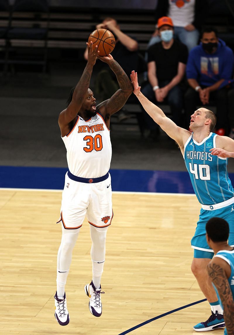 Julius Randle #30 of the New York Knicks takes a three point shot as Cody Zeller #40