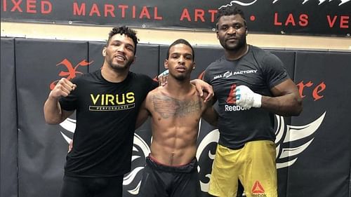 Brothers Kevin Lee and Keith Lee pose with UFC champ Francis Ngannou [Photo via @keith_lee125 on Instagram]