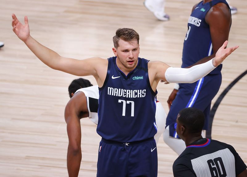 Luka Doncic (#77) of the Dallas Mavericks reacts after being charged with a foul/